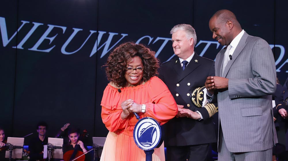 Oprah Winfrey with Nieuw Statendam's Captain Sybe de Boer and Holland America Line President Orlando Ashford