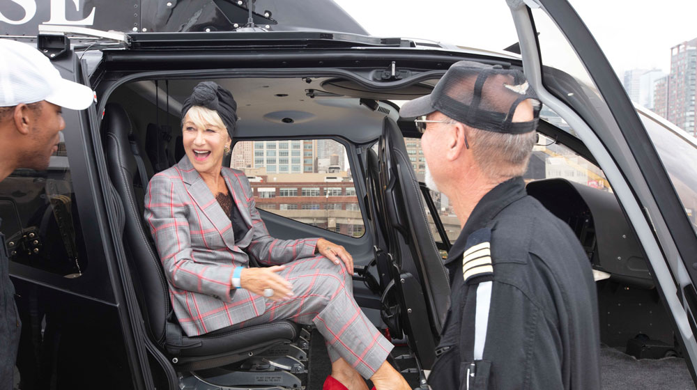 Dame Helen Mirren, Scenic Eclipse's godmother, aboard one of the ship's two helicopters