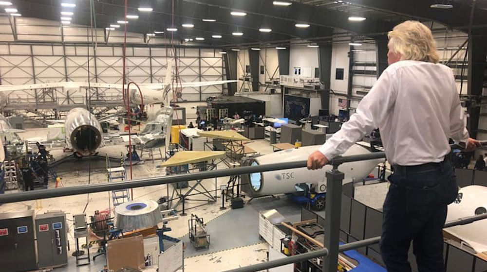 Richard Branson overlooks production at FAITH (Final Assembly Integration and Test Hangar) in Mojave | Image Credit: Virgin Galactic/Greg Rose